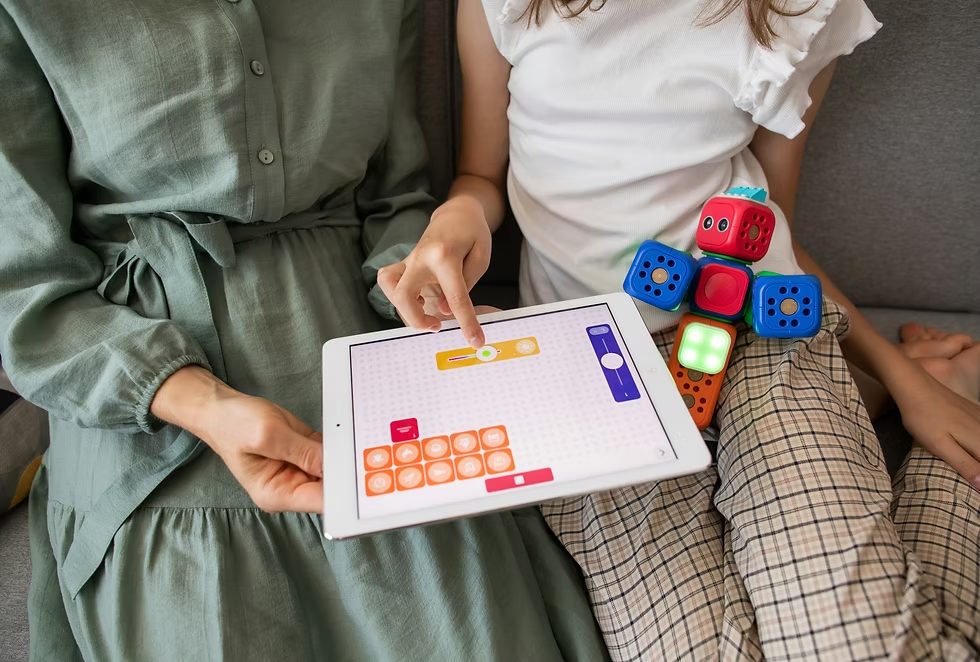 A parent and child using a learning app on a tablet